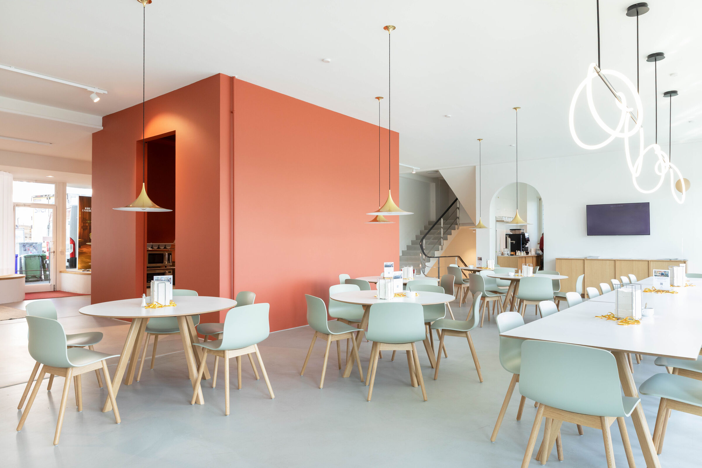 Cafeteria with the red cube, where fresh meals are served.