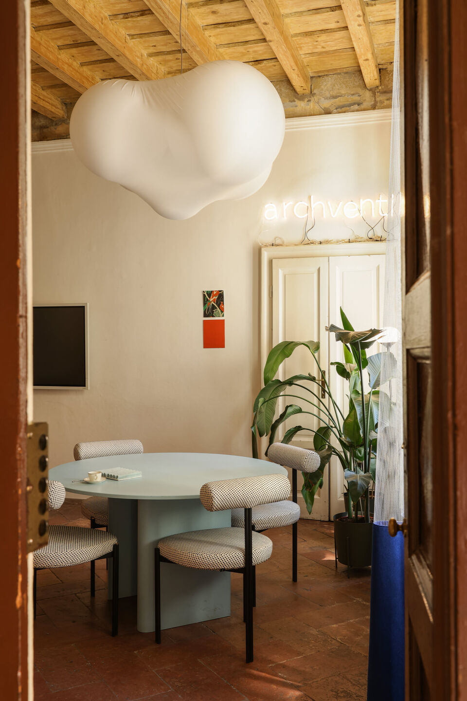 View from the entrance into the main meeting area, where historic architecture meets contemporary design.