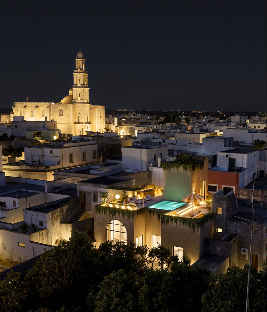 Night view across Lequile’s historic rooftops