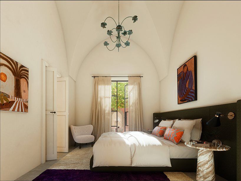 Serene bedroom beneath traditional vaulted architecture