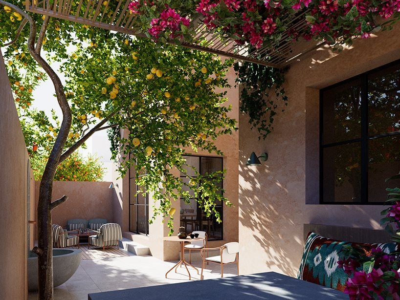 Shaded courtyard framed by mature Mediterranean planting