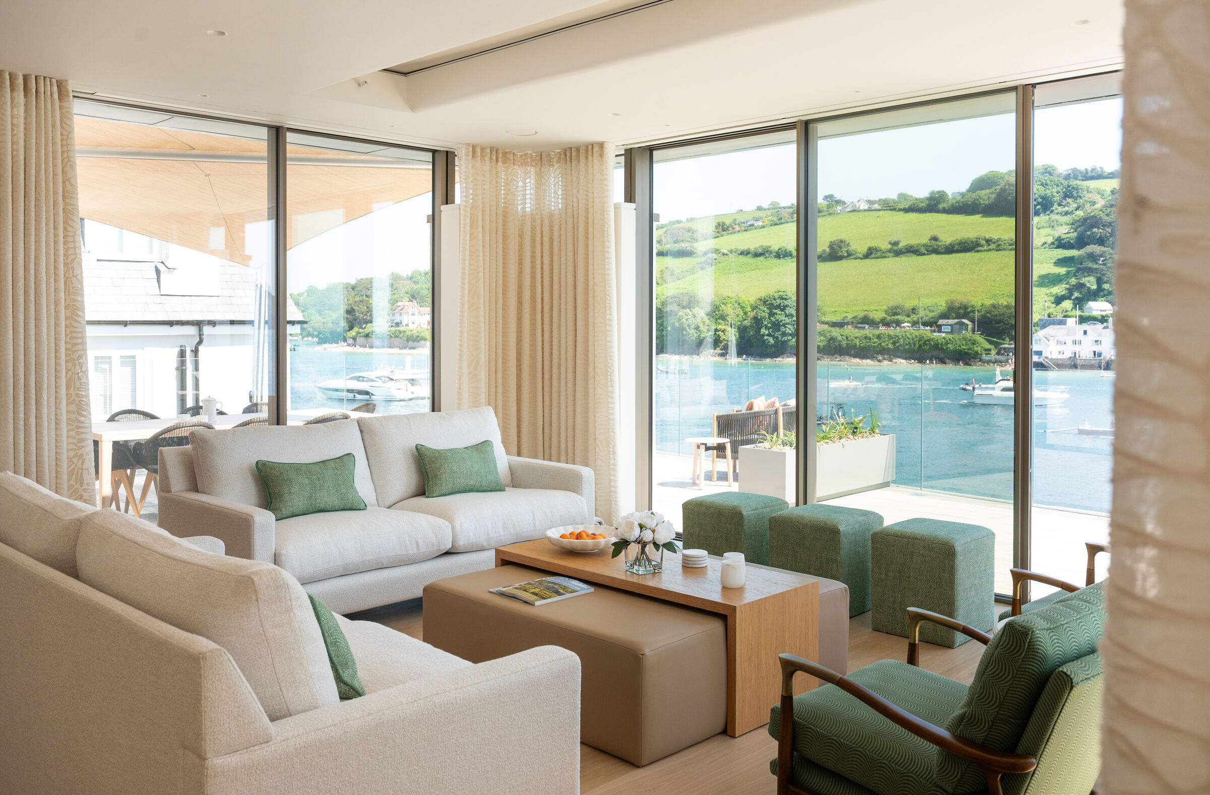 Living room at Orestone End with minimal sliding doors overlooking the Salcombe coastline