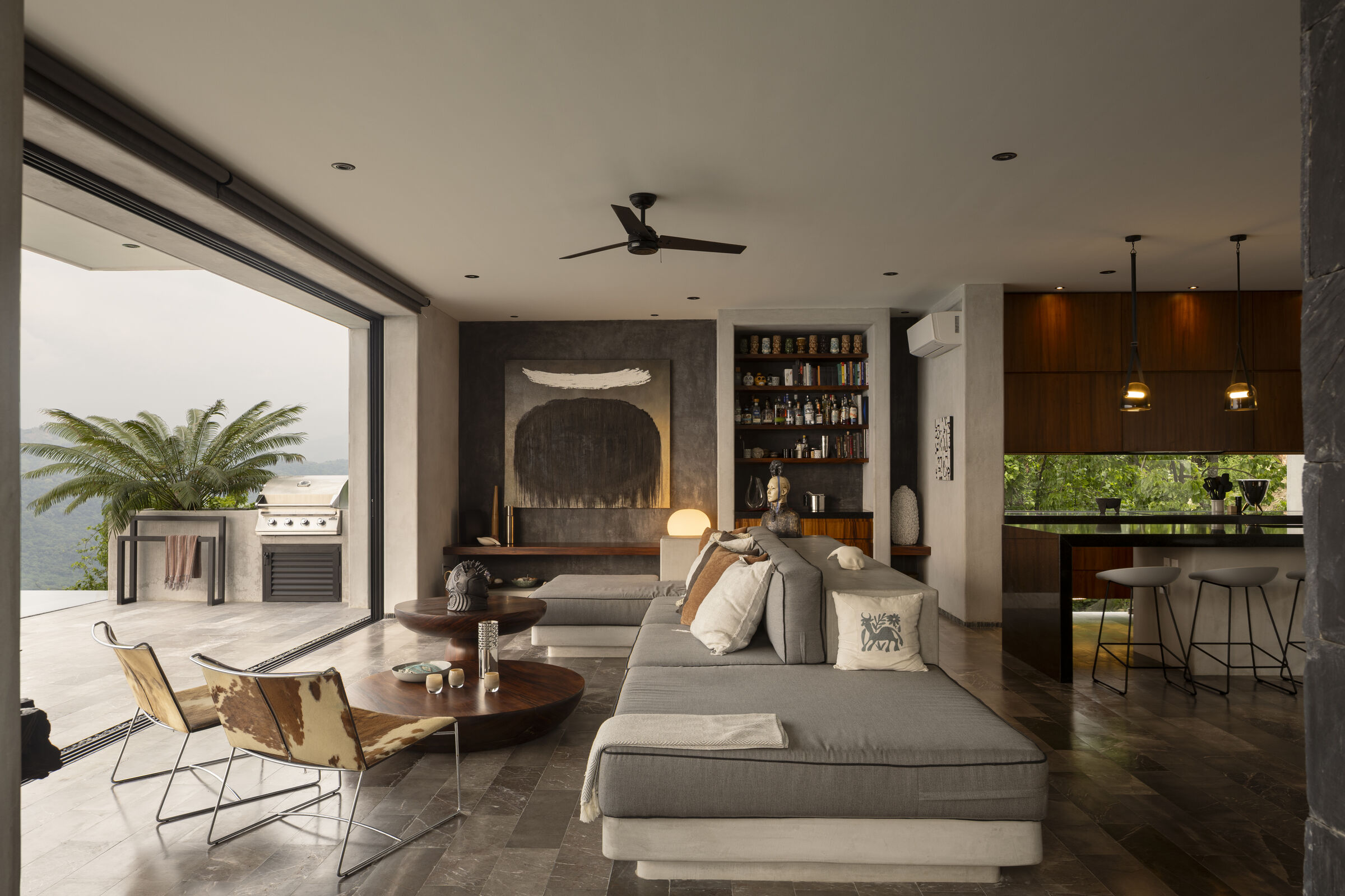 Artworks and carefully curated objects throughout the living room reflect the creative spirit of the homeowners.
