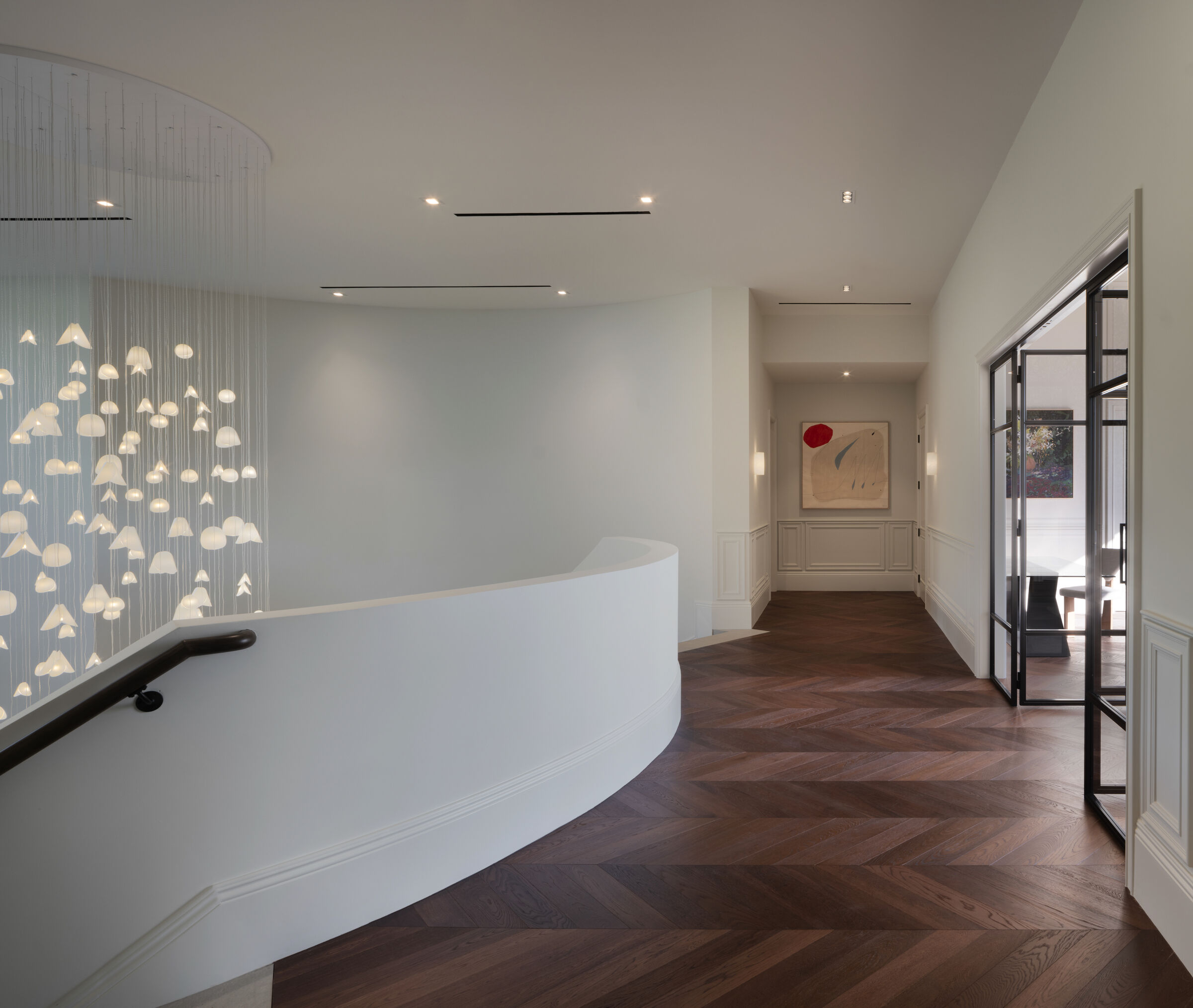 Designed to the architecture, this custom Bivalvia installation brings scale, movement and light to the foyer.