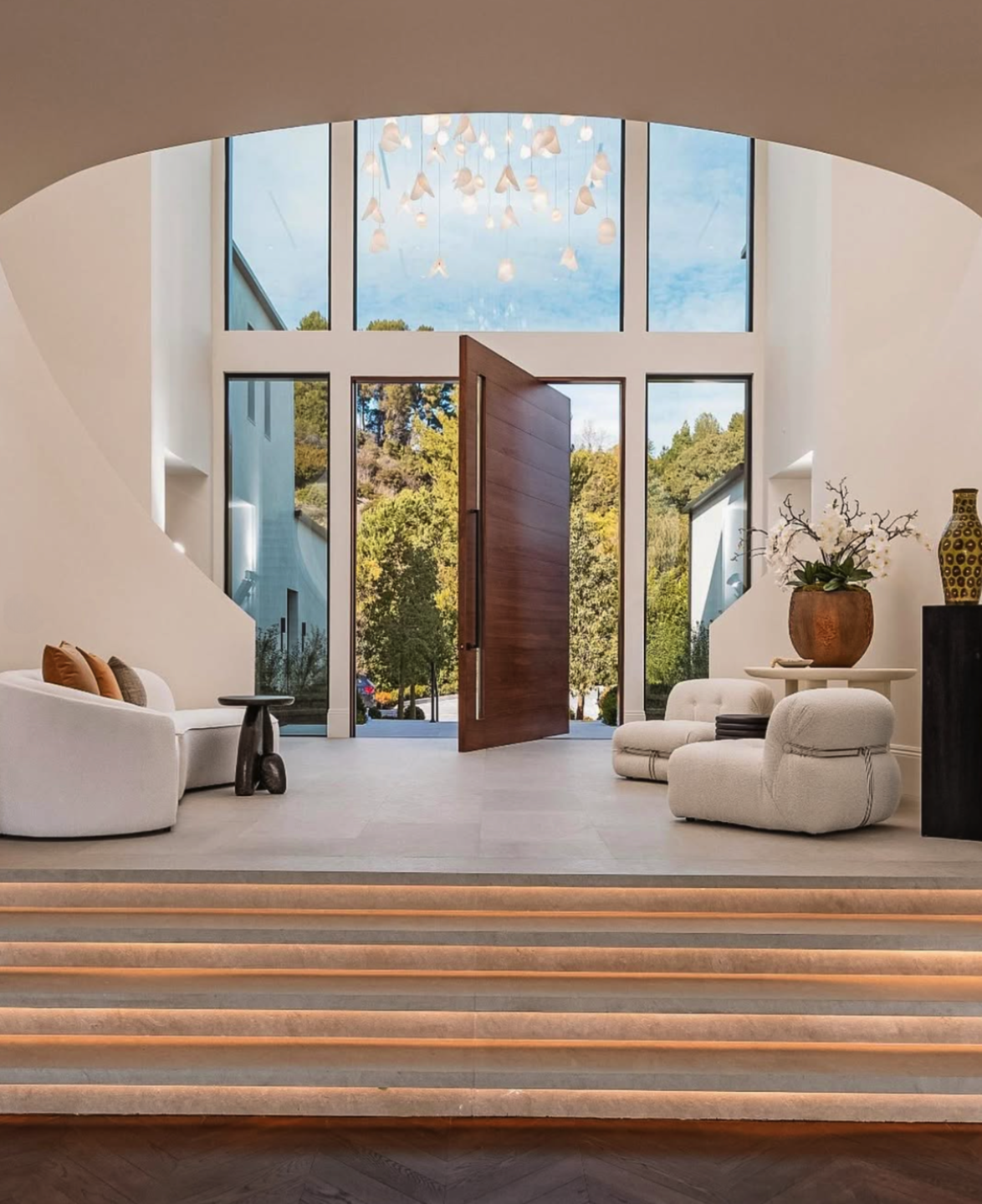 Designed to the architecture, this custom Bivalvia installation brings scale, movement and light to the foyer.