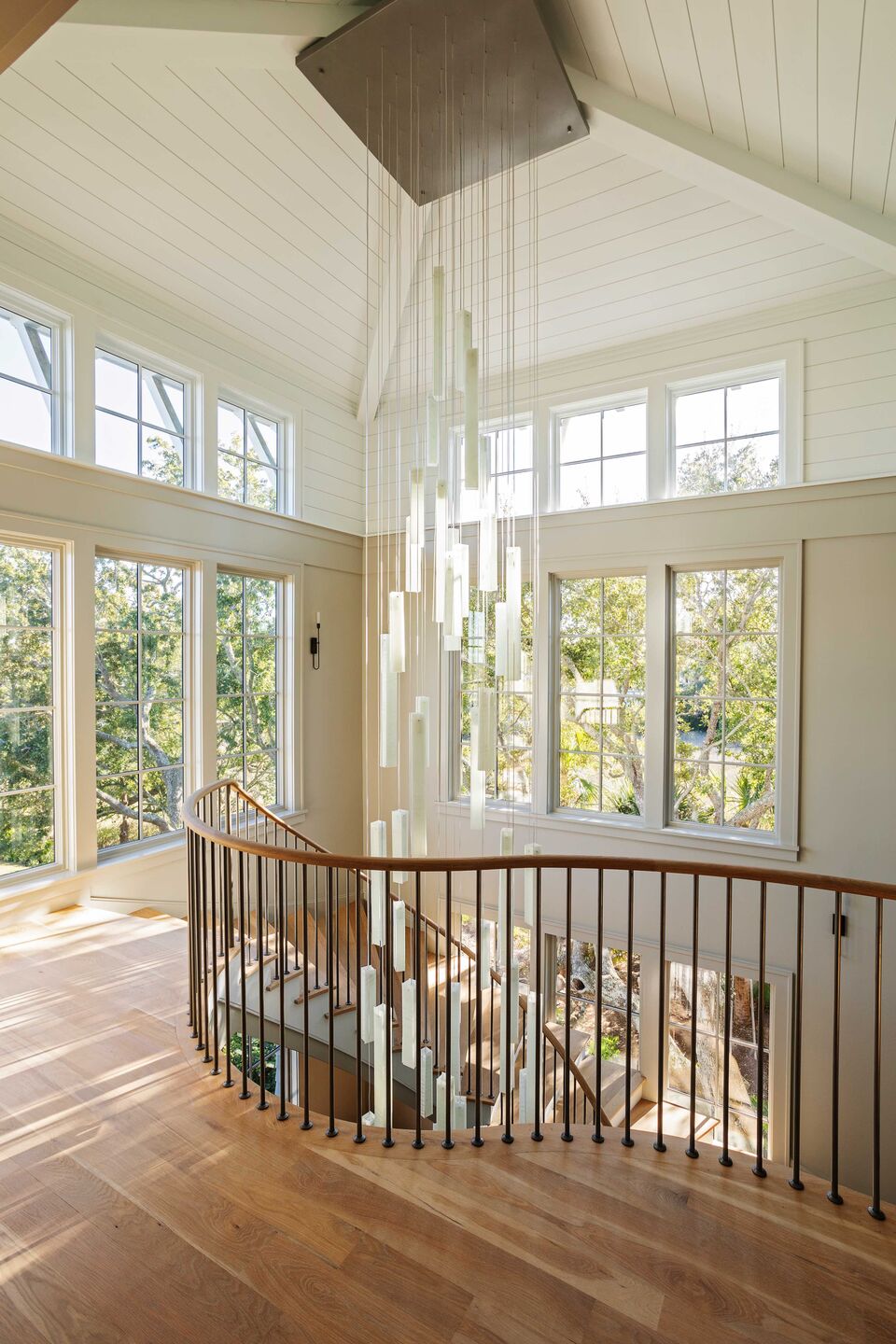 Natural light and translucent glass create a soft, airy presence within the architecture.