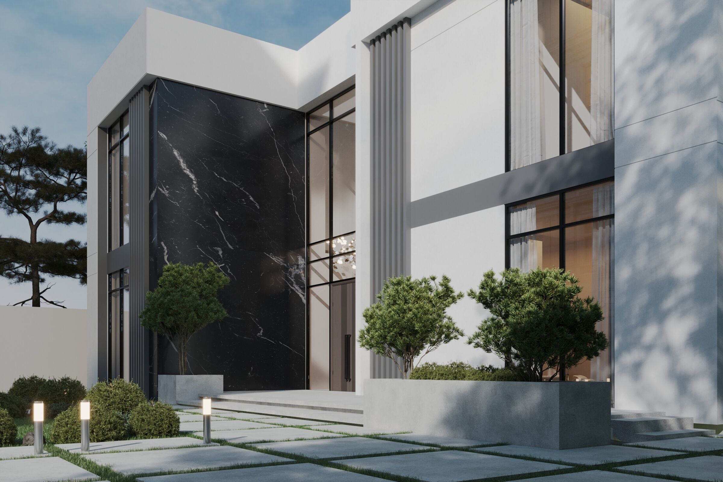 Close view of the entrance composition, vertical fins and dark stone feature wall.