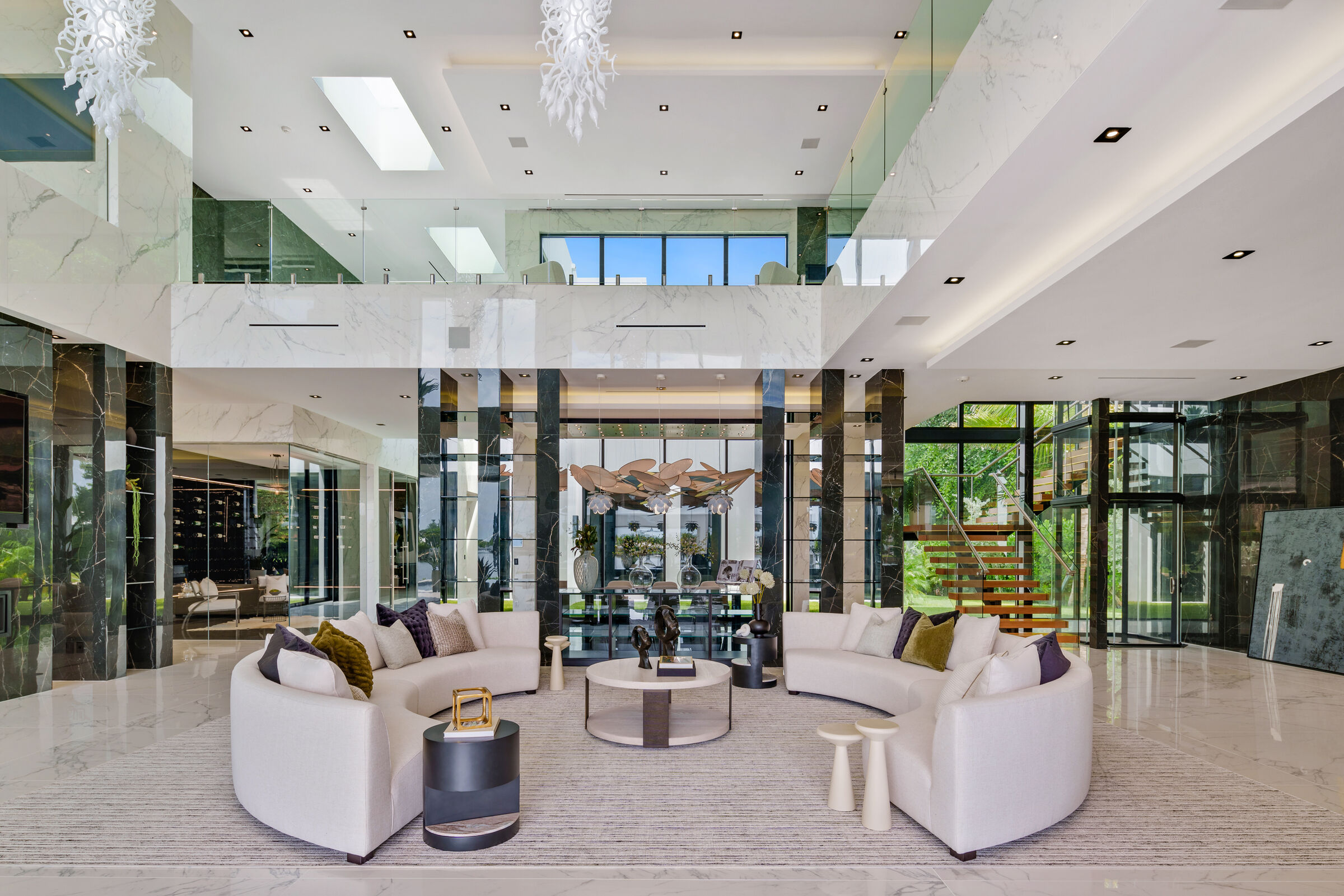 Dragon chandelier viewed within the expansive double-height interior.