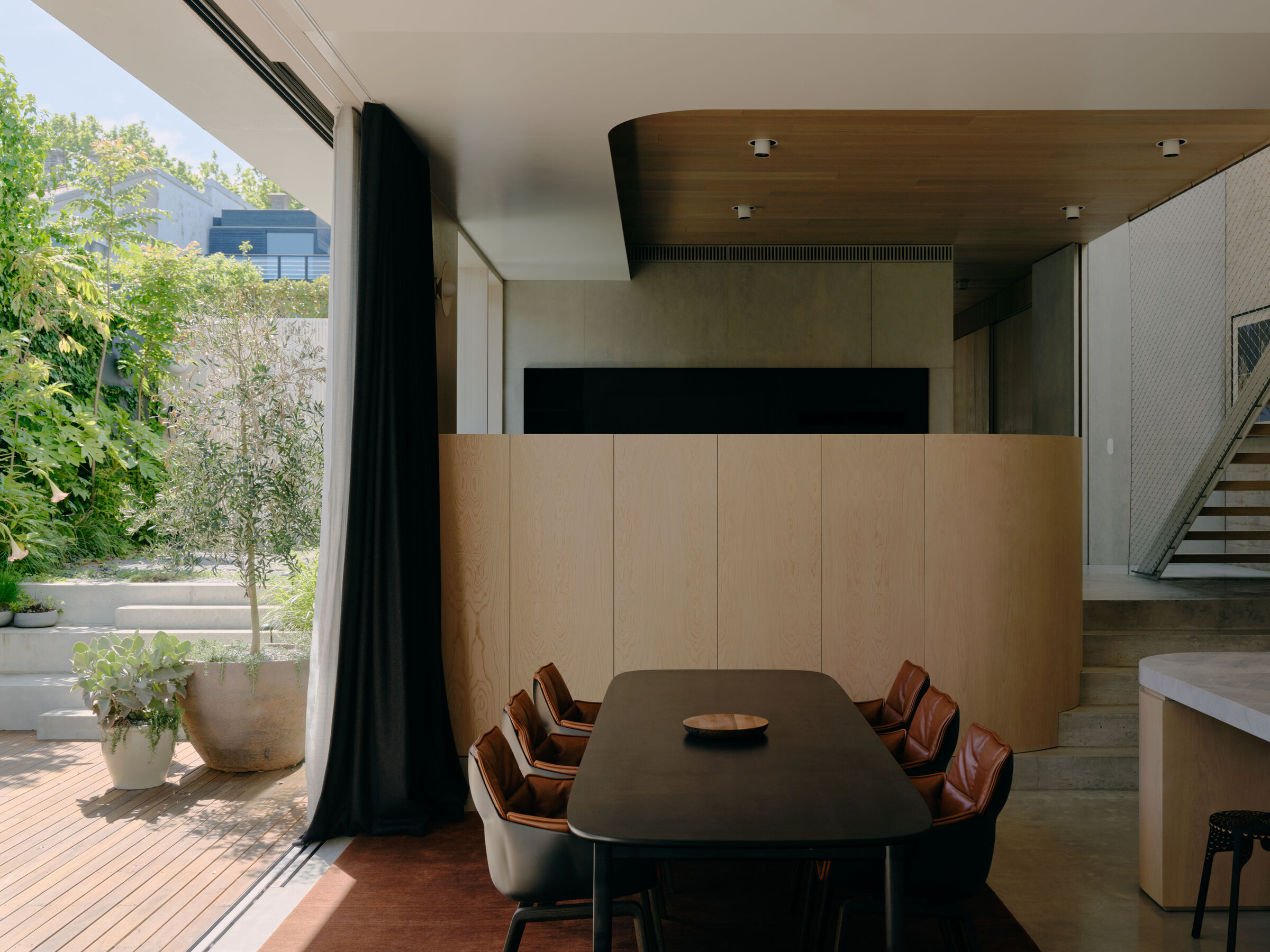 The dining area connects to the landscaped courtyard.