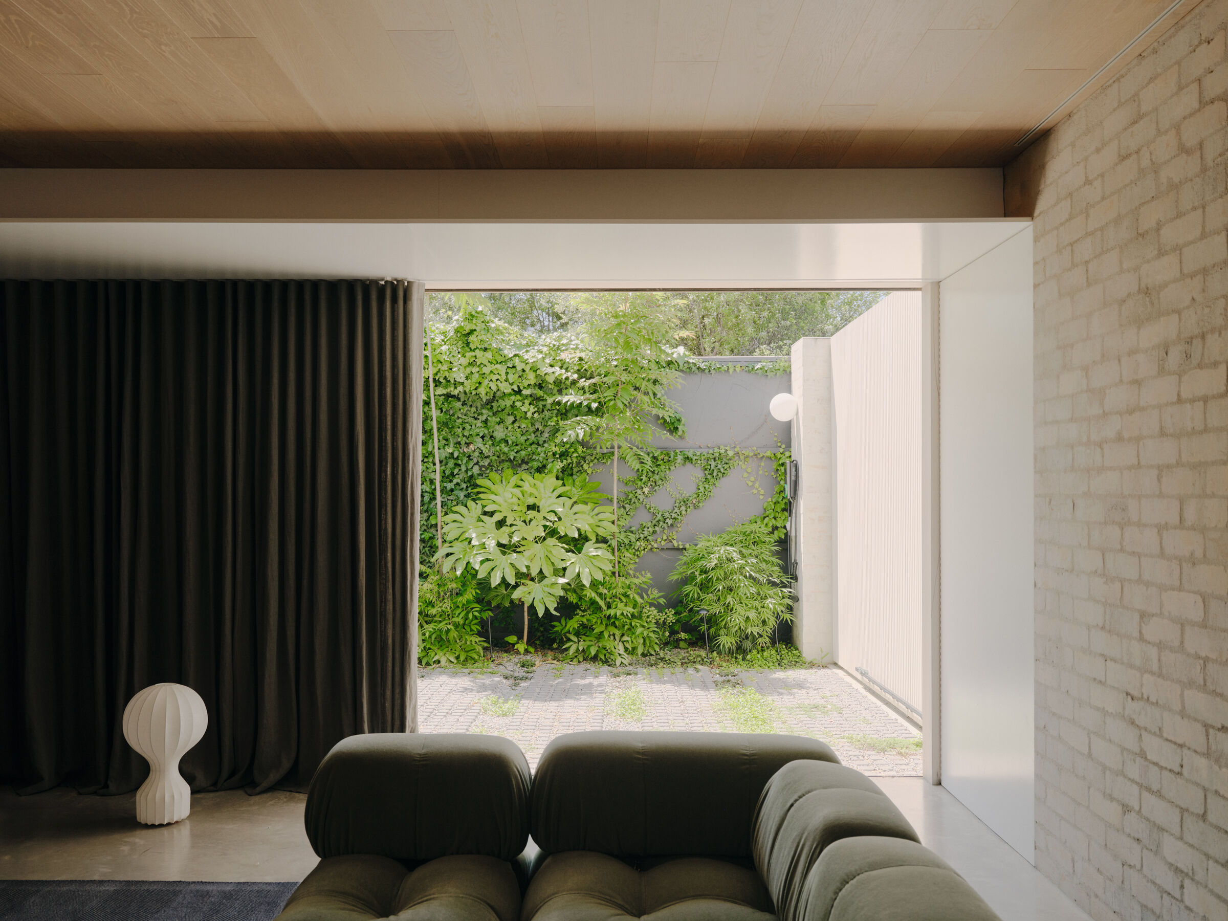 The ground level rumpus room with a connection to the landscaped yard.