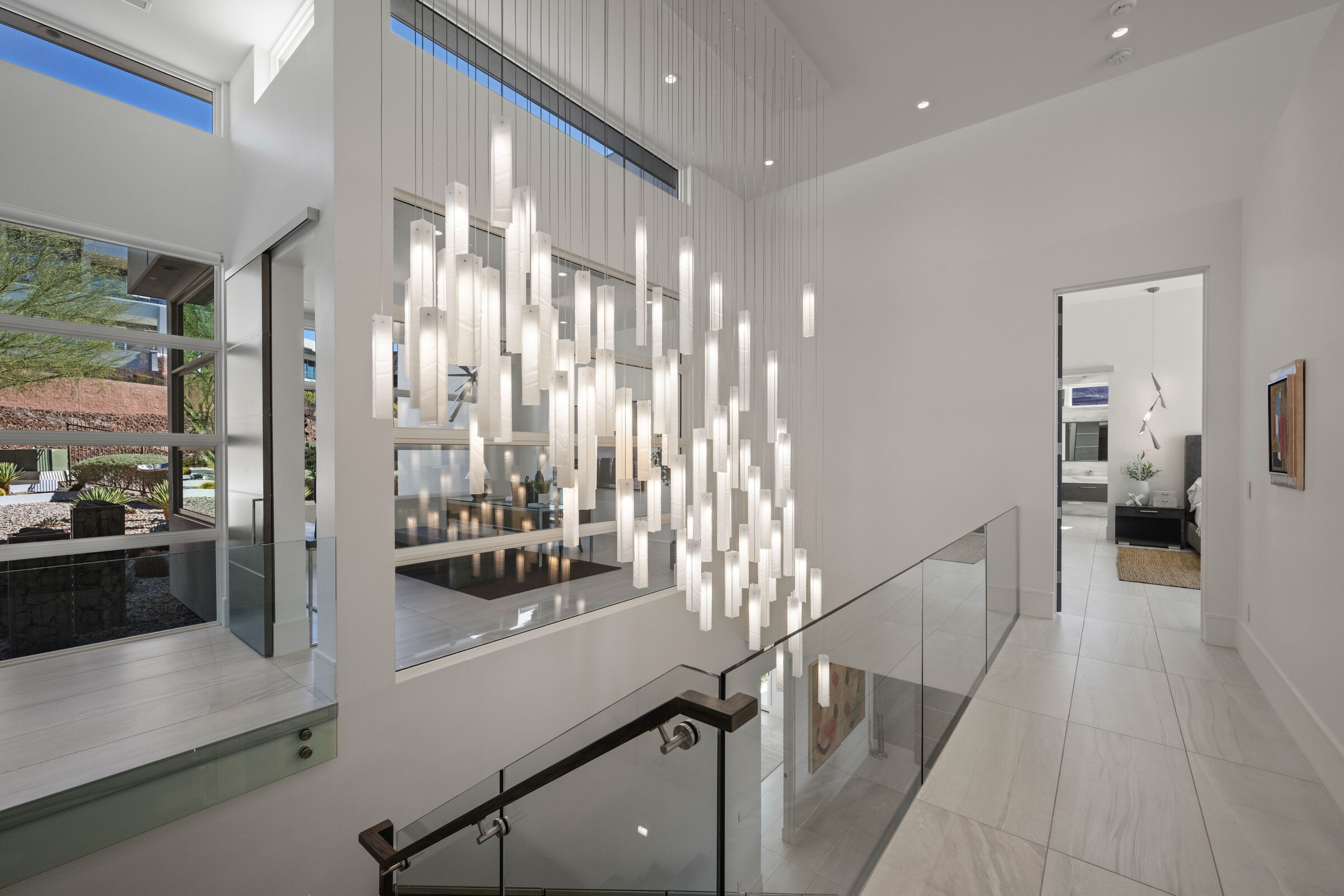 A cascading composition shaped to follow the architecture of the stairwell.