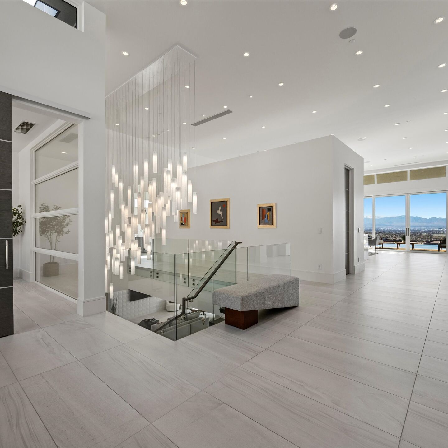 Illuminated glass art creating a sculptural focal point within the open-plan residence.