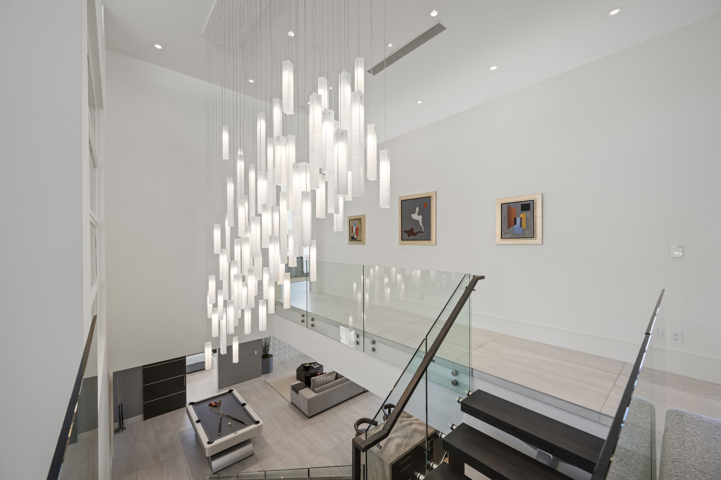 Sculptural glass installation designed for the double-height staircase.