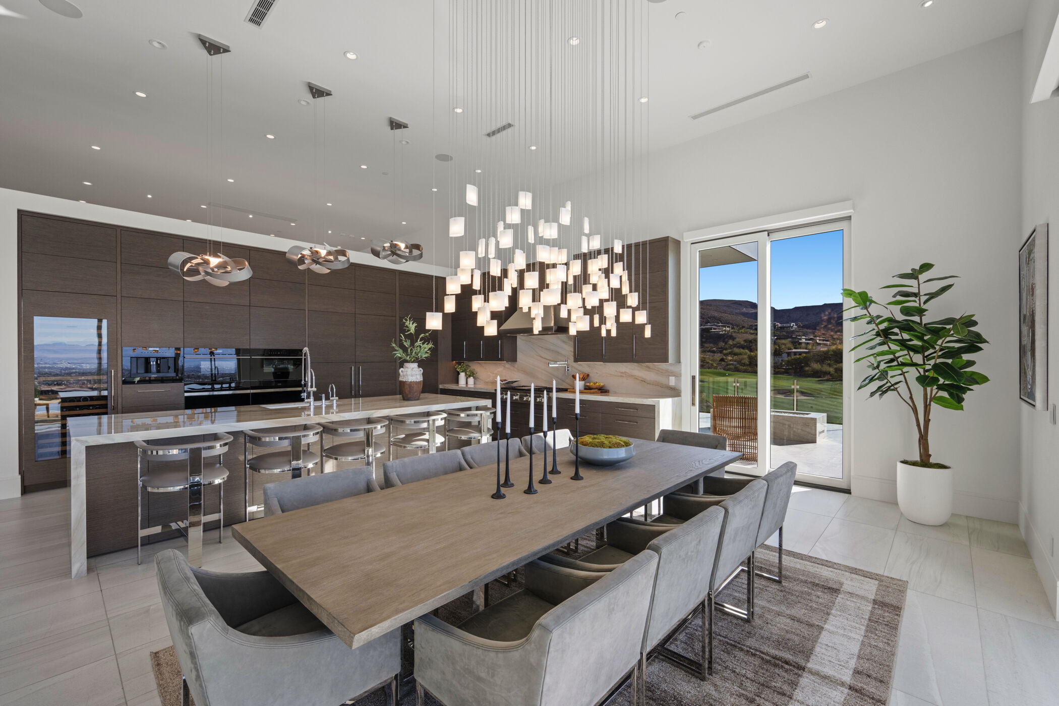 Dining and kitchen lighting designed as part of one cohesive artistic language.