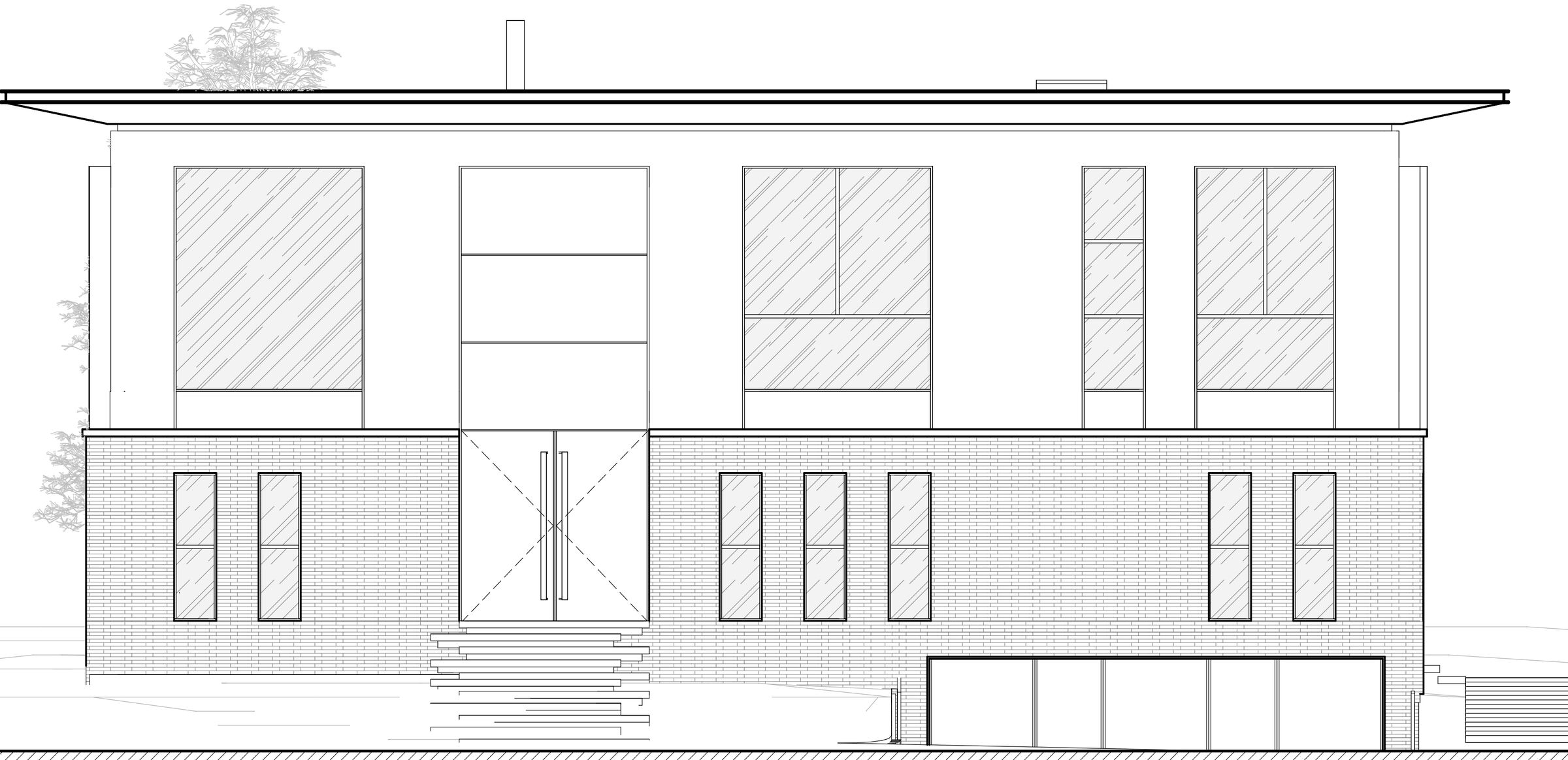 North façade facing the street, showing the main entrance and vehicular access to the basement.