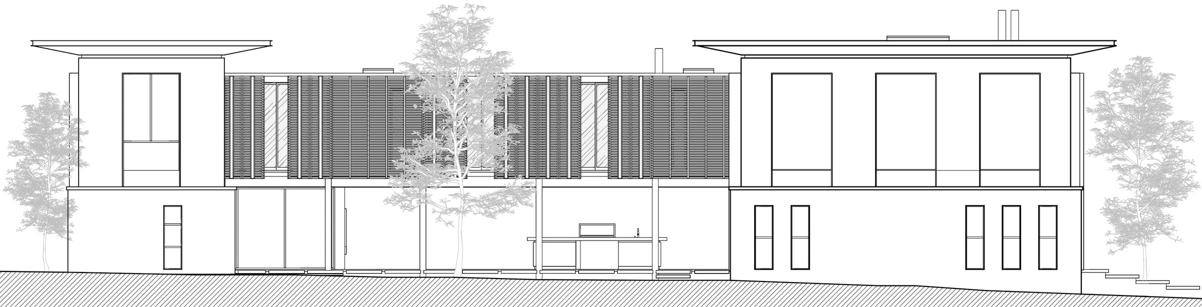 East façade. The aluminum second skin connects the volumes while controlling solar exposure, privacy, and views