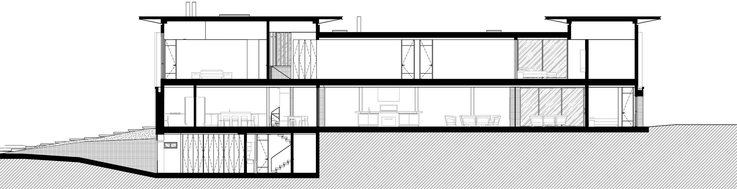 Main section through the double-height social spaces and the connections between levels.