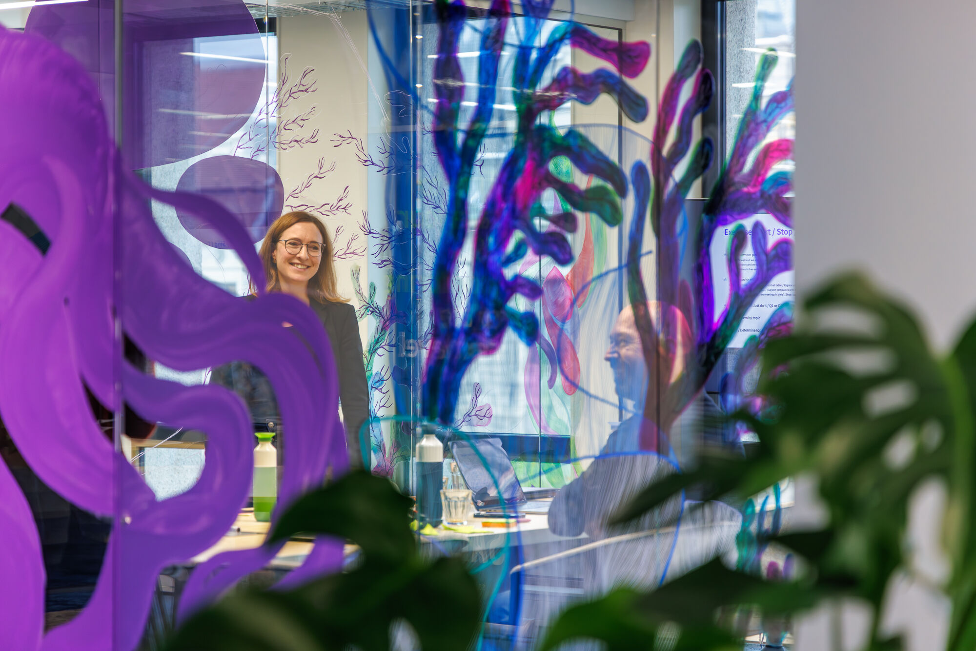Mural continues on the glass of the meetingroom