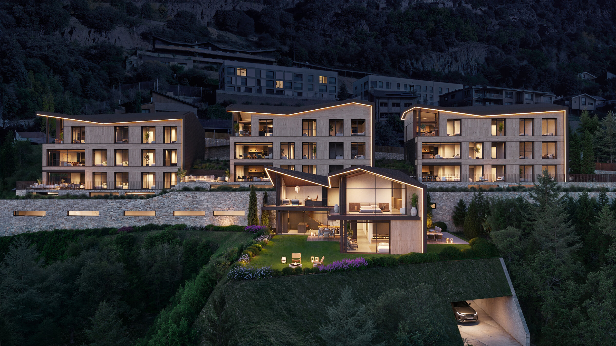 Night view of Jardins d'Antuix development, lit from within