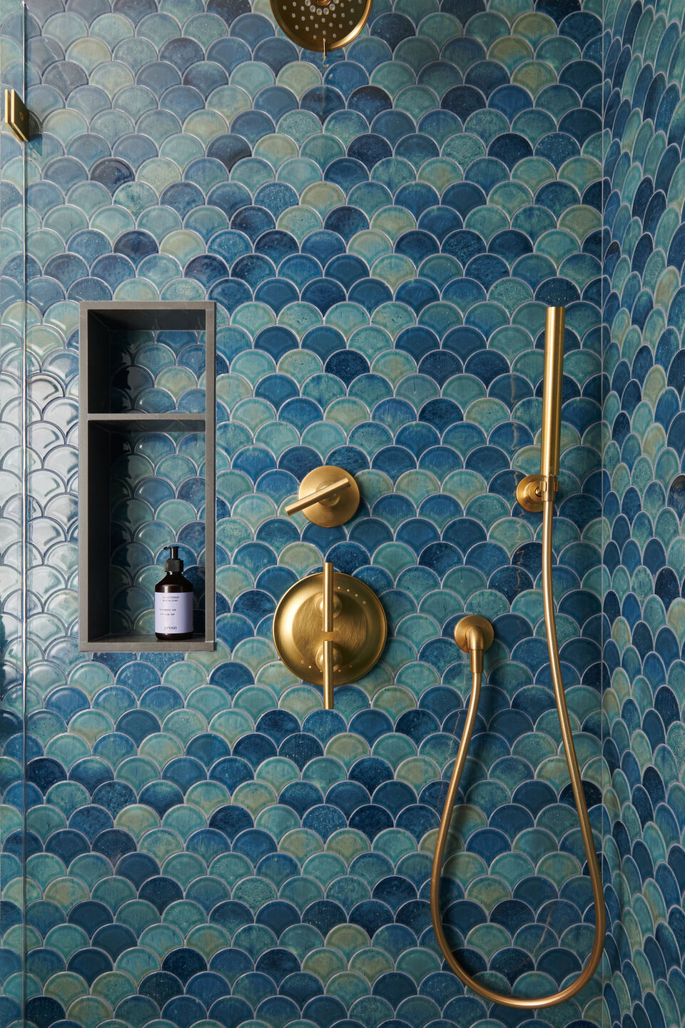 Daltile scalloped blue tiles offers a deep saturated space