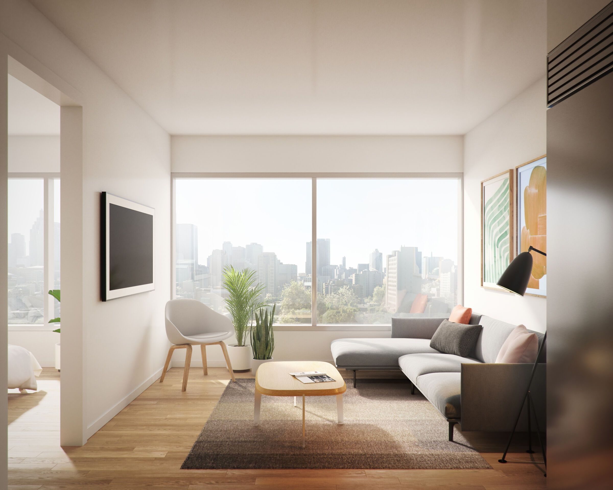A light-filled suite interior at Primrose Hill frames expansive views across the Toronto skyline, pairing wide horizontal glazing with warm wood flooring and refined living spaces.