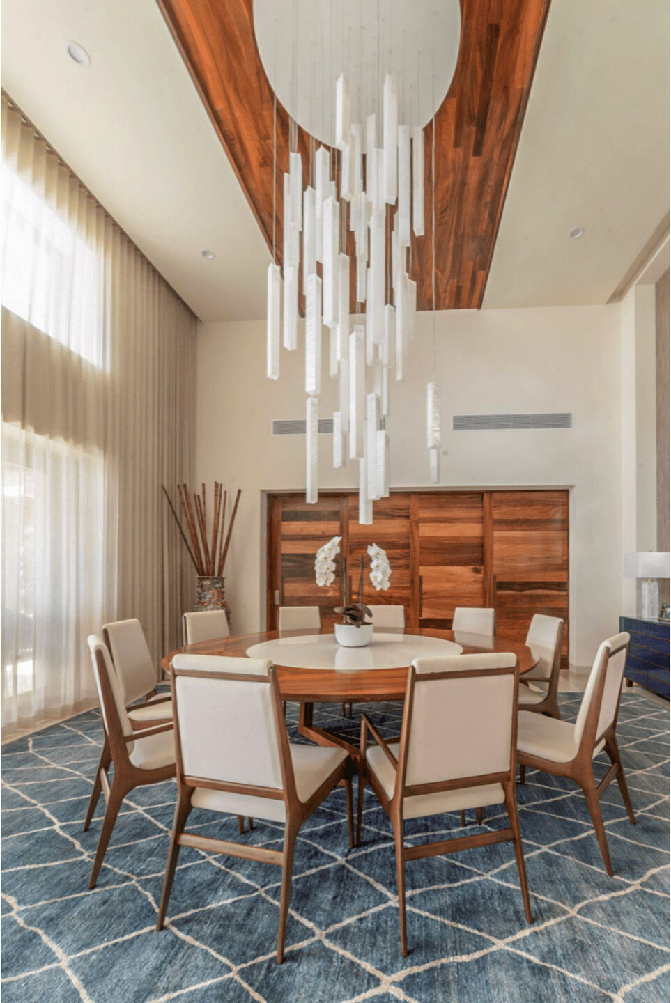 Handcrafted glass chandelier suspended above the dining table at Villa Marselina in Los Cabos, Mexico.
