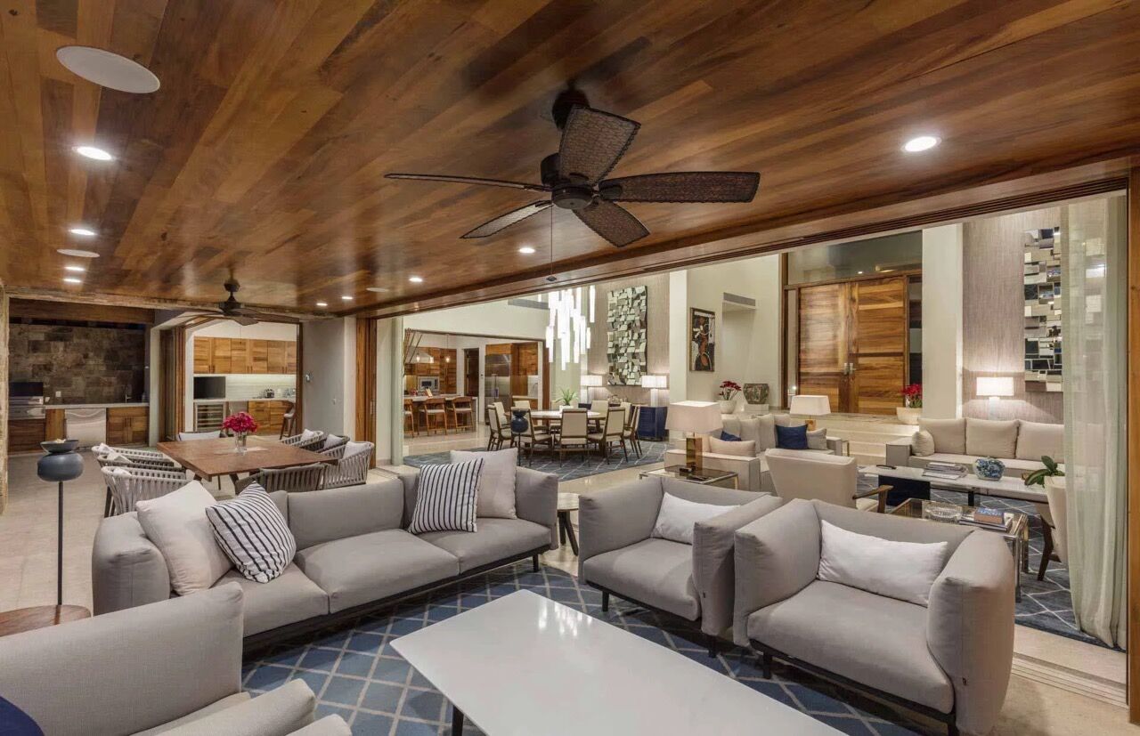 Contemporary living area at Villa Marselina, where architecture, natural materials and custom lighting flow throughout the home.
