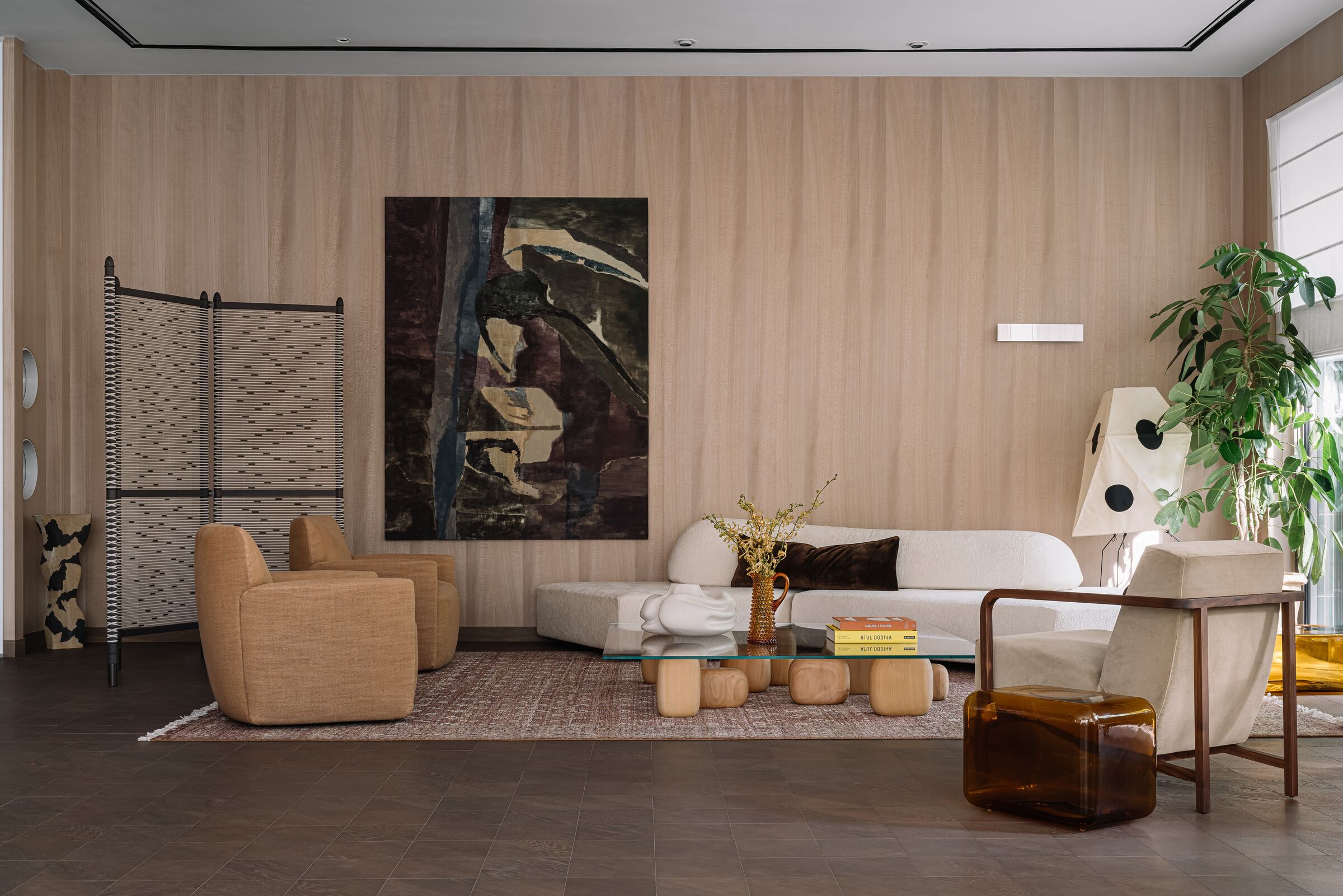 Living Room with an Edra Sofa, Depadova tables & chairs, Vitra Lamp, Davide Groppi wall light, Foglie'D'Oro Flooring, Carpet from Jaipur Rugs