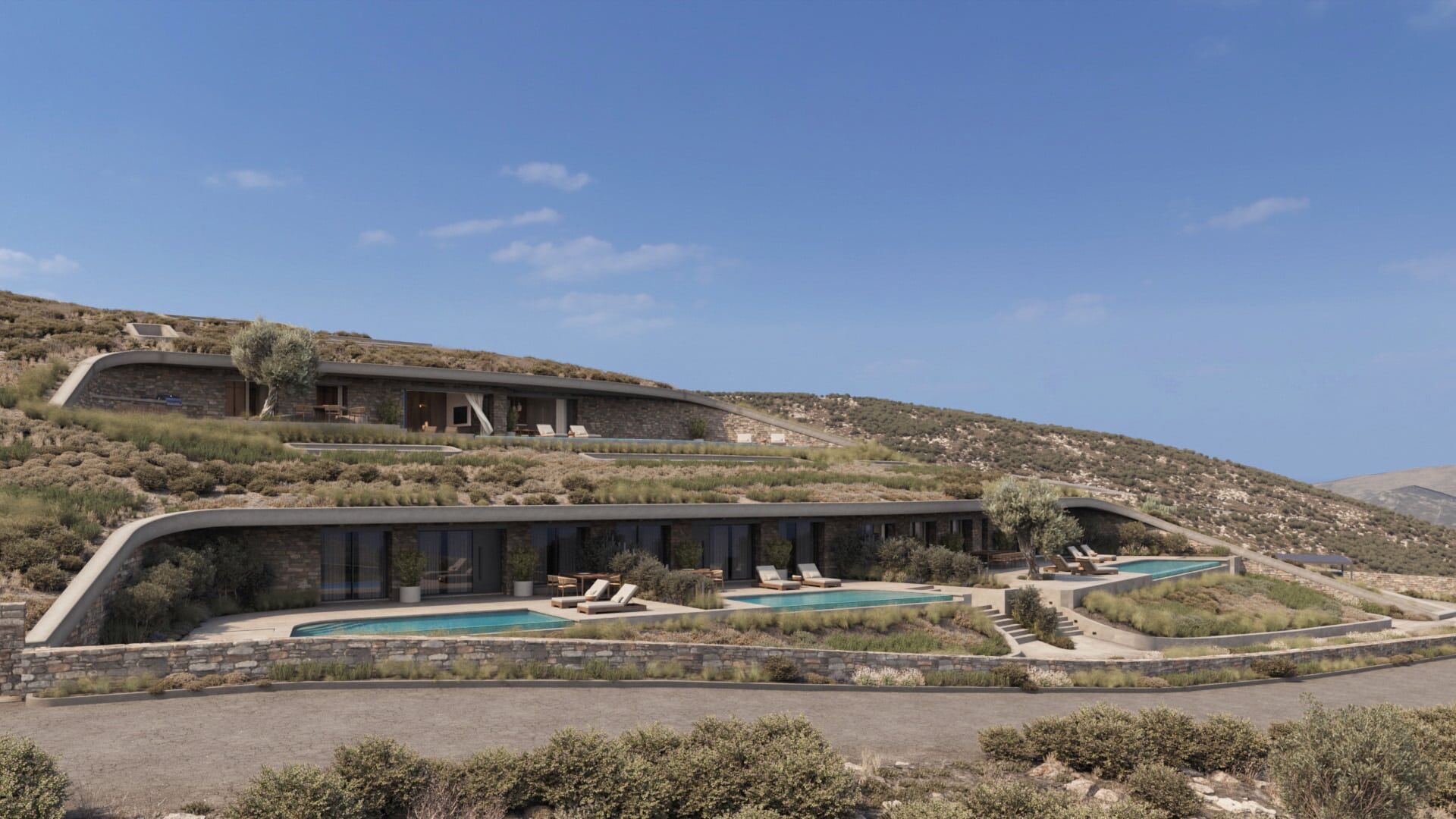 Overall view of the cave residences integrated into the hillside landscape.