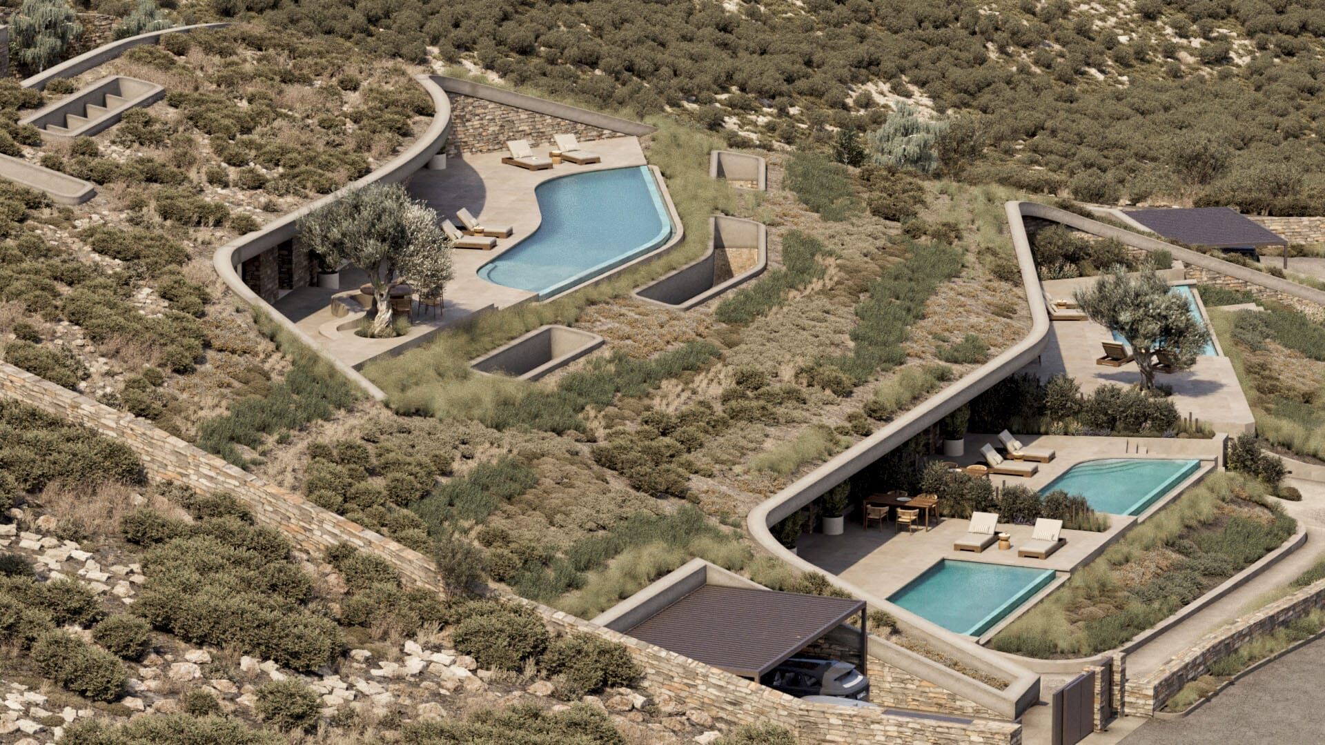 Aerial view showing the residences integrated into the natural slope of the landscape.