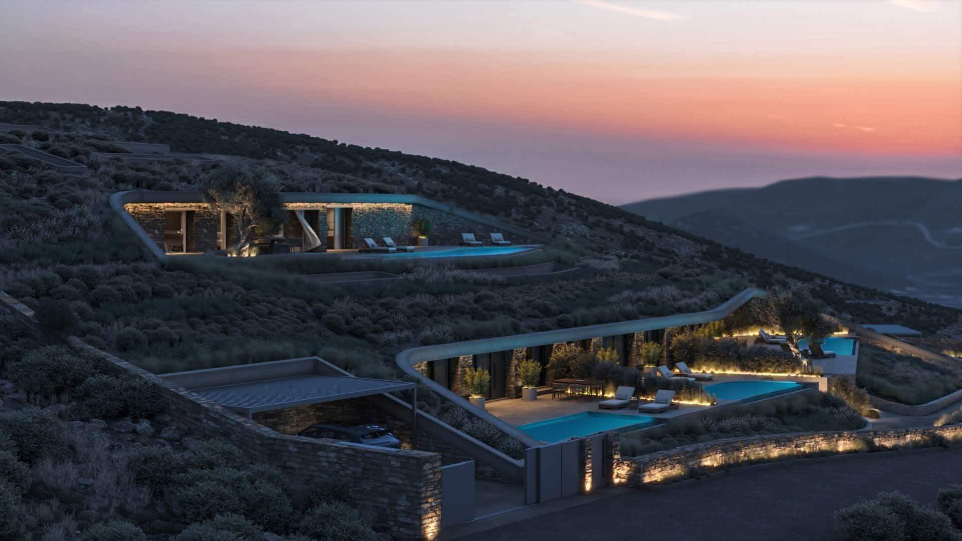Dusk view of the residences following the natural contours of the hillside.