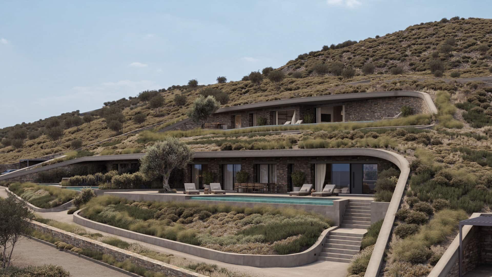 Cave residence embedded into the hillside, with a planted roof and private pool.