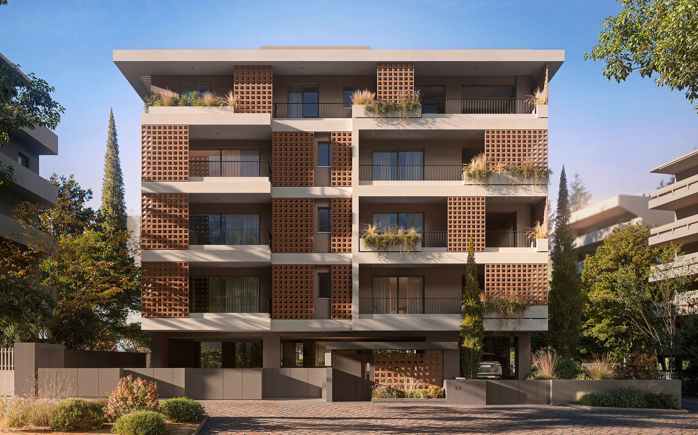 Street elevation defined by strong horizontal slabs and a rhythmic composition of ceramic screens.