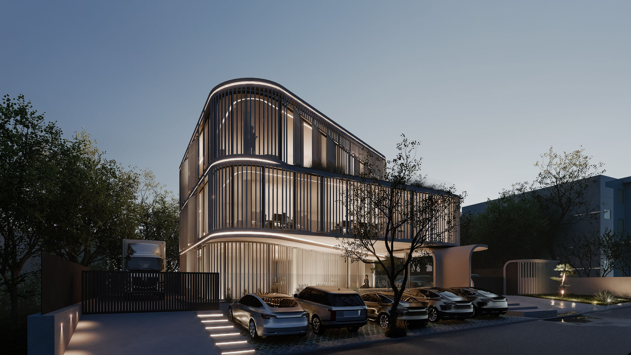 At dusk, interior light filters through the louvers, revealing the geometry behind the facade.
