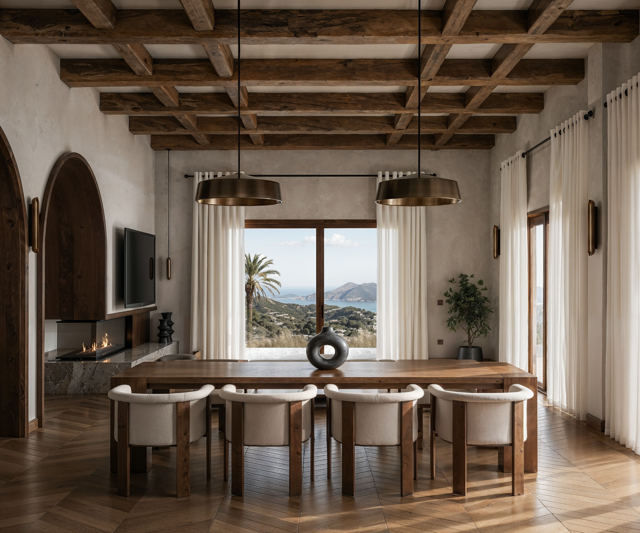 Exposed timber ceiling beams, bespoke wooden furniture, and expansive sea views shape a contemporary dining area that connects the interior with the landscape of Karpathos.