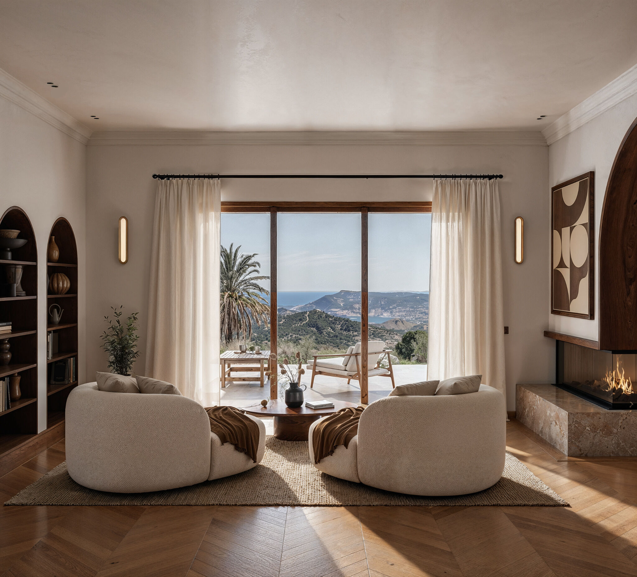 Soft sculptural seating and full-height glazing create a relaxed living environment, framing panoramic views of the Aegean Sea from this contemporary residence in Karpathos.